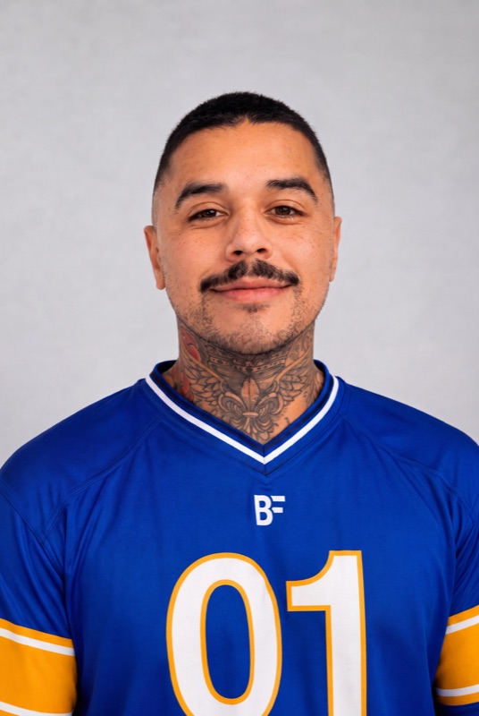 Brook, founder of Brook Frameworks, in a blue BF team jersey with the number 01